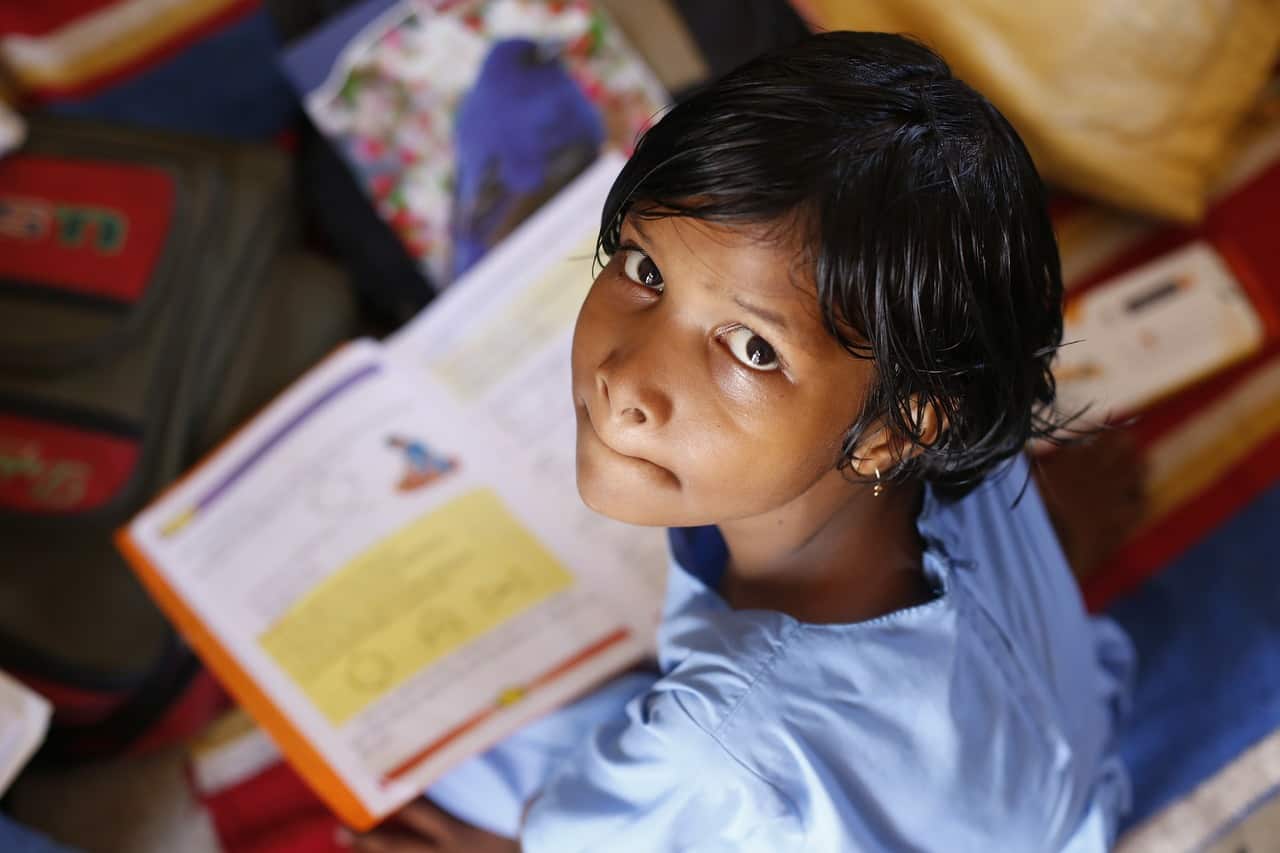 Poor child studying in rural school