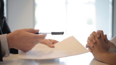 crop businessman giving contract to woman to sign 3760067