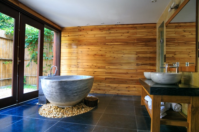 round white and gray ceramic bathtub inside brown room 2134224