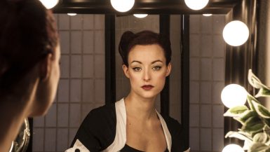 woman looking at mirror