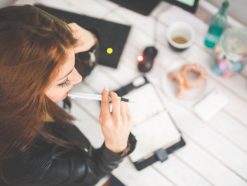 young woman thinking with pen while working studying at her 6384